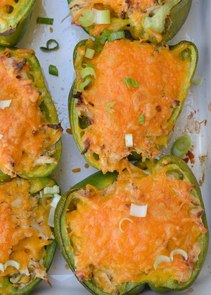 These six ingredient Green Chile Chicken Stuffed Peppers have under 5 net carbs per serving! Packed with chicken, cheese and spices, this is an easy dinner your entire family will love!
