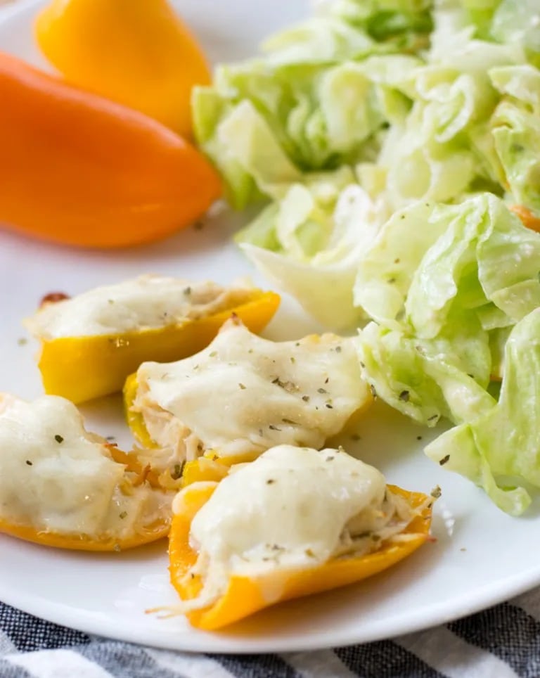 These easy Keto Cheesy Chicken Stuffed Peppers are about one net carb each! A great low carb, healthy dinner or snack under 5 net carbs per serving!