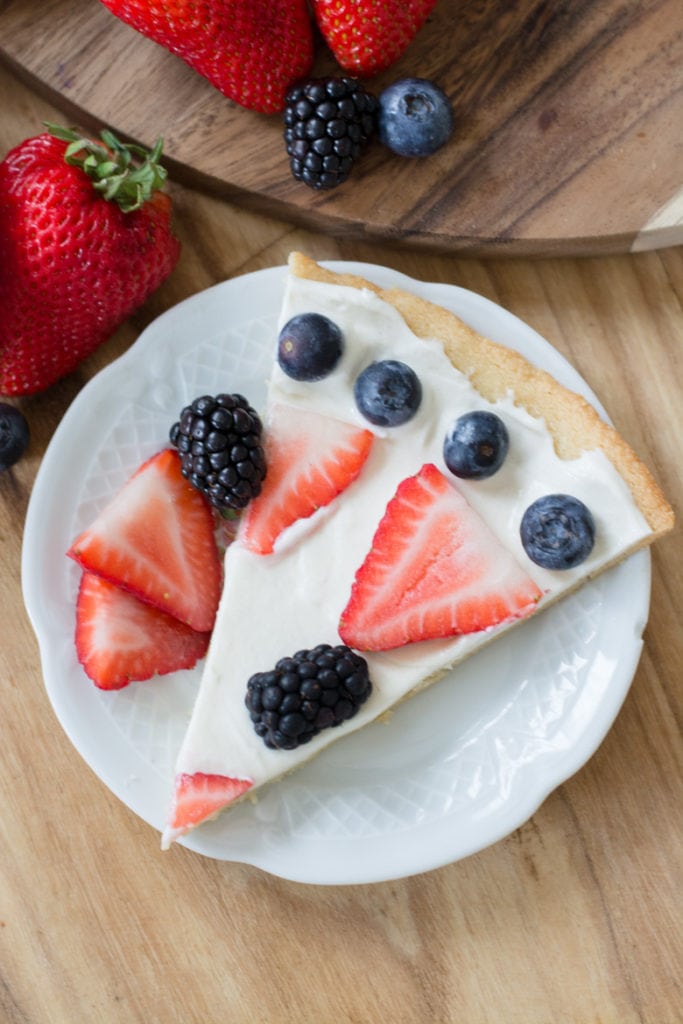 You can enjoy a summer favorite even on Keto! This Keto Fruit Pizza is high in flavor and low in carbs. Perfect for all of your summer cookouts! Only 5.4 net carbs per slice!  #keto