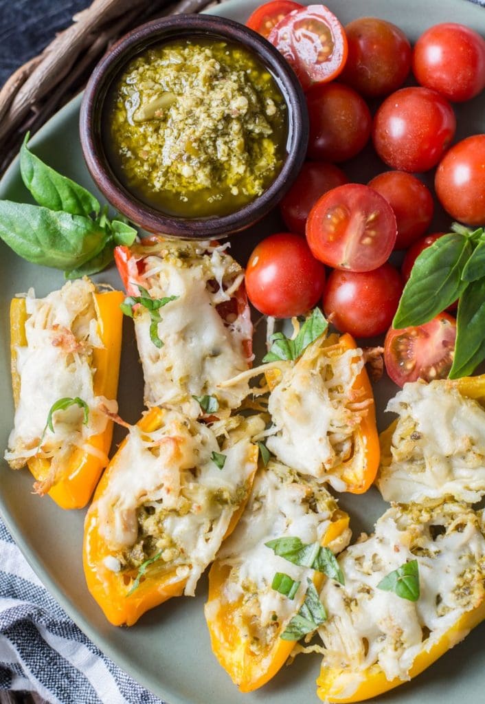 Keto Pesto Chicken Stuffed Sweet Peppers, a simple FOUR ingredient dinner that is healthy and gluten free! Under 6 net carbs per serving!