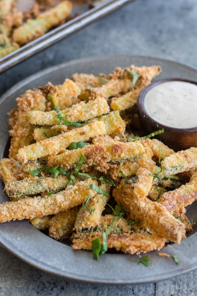 These Crispy Zucchini Fries are breaded with almond flour, parmesan and spices and baked until perfectly crispy! The perfect keto, low carb side dish! #keto
