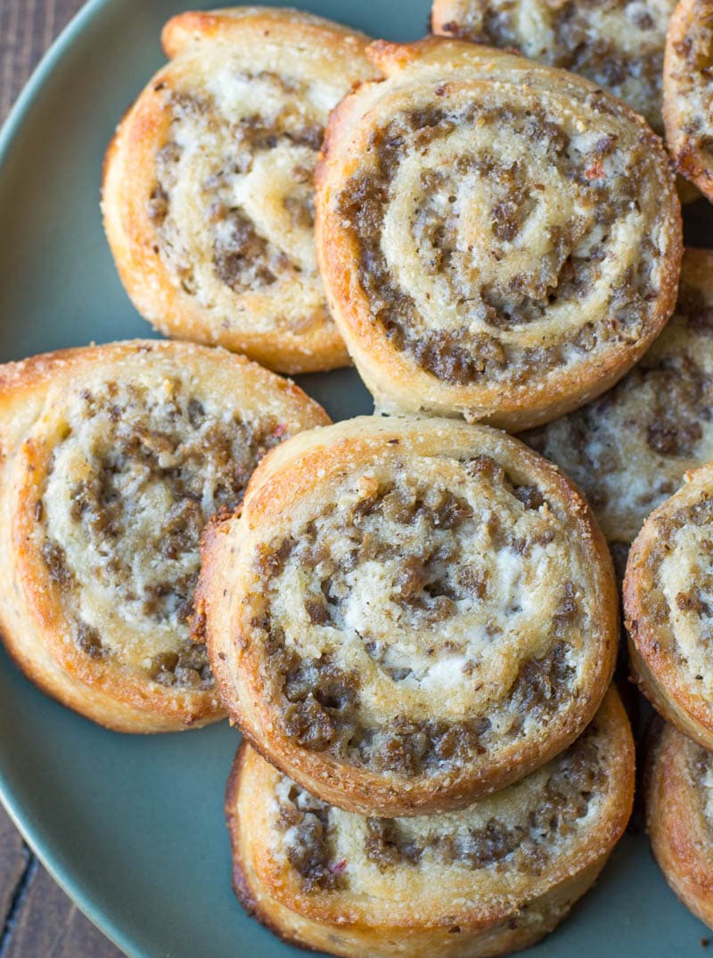 The perfect keto appetizer! Keto Sausage Cream Cheese Pinwheels are made with fat head dough and loaded with sausage and cream cheese! Just two net carbs per serving! #keto