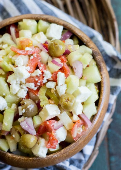 This Greek Cucumber Salad is packed with fresh vegetables and topped with tangy feta cheese! A great low carb salad under 4 net carbs per serving!
