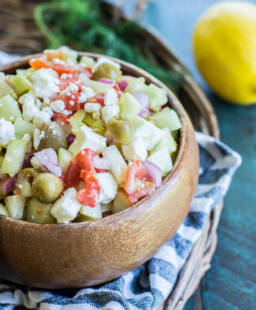 This Greek Cucumber Salad is packed with fresh vegetables and topped with tangy feta cheese! A great low carb salad under 4 net carbs per serving!