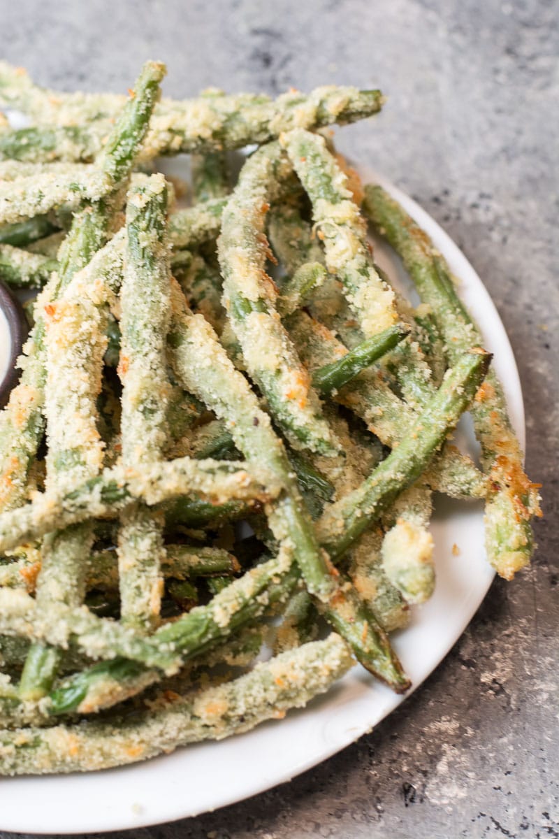 Try these low carb Crispy Green Bean Fries perfect for a game day snack! You can make these keto fries in the oven or air fryer! 