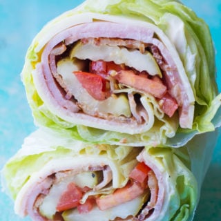 Looking for a new keto lunch? This Keto Club Lettuce Wrap is packed with thick slices of ham, bacon, cheese, crunchy lettuce and juicy tomatoes! This filling lunch is under 4 net carbs! #keto