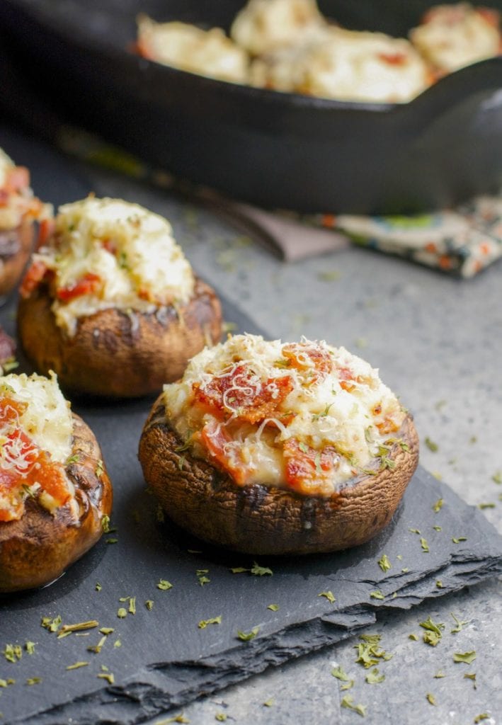 These Crab and Bacon Stuffed Mushrooms are packed with creamy cheese, salty bacon and lumps of crab meat. The perfect low carb, keto, five ingredient appetizer! #keto