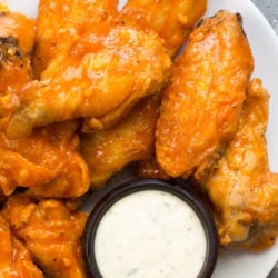 These Keto Chicken Wings are ultra crispy with no breading then covered in a buttery, tangy buffalo sauce! Only 4 net carbs per serving!