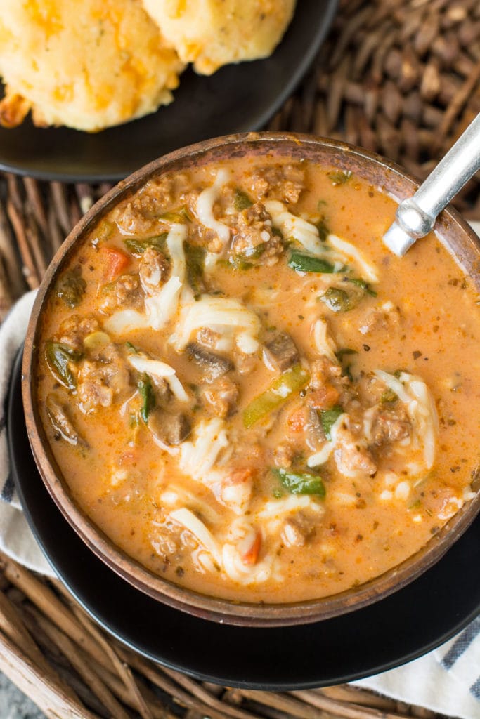 This easy Instant Pot Pizza Soup is loaded with meat and vegetables in an ultra creamy broth! At about 7 net carbs per serving this is a low carb soup you'll enjoy all winter long! 