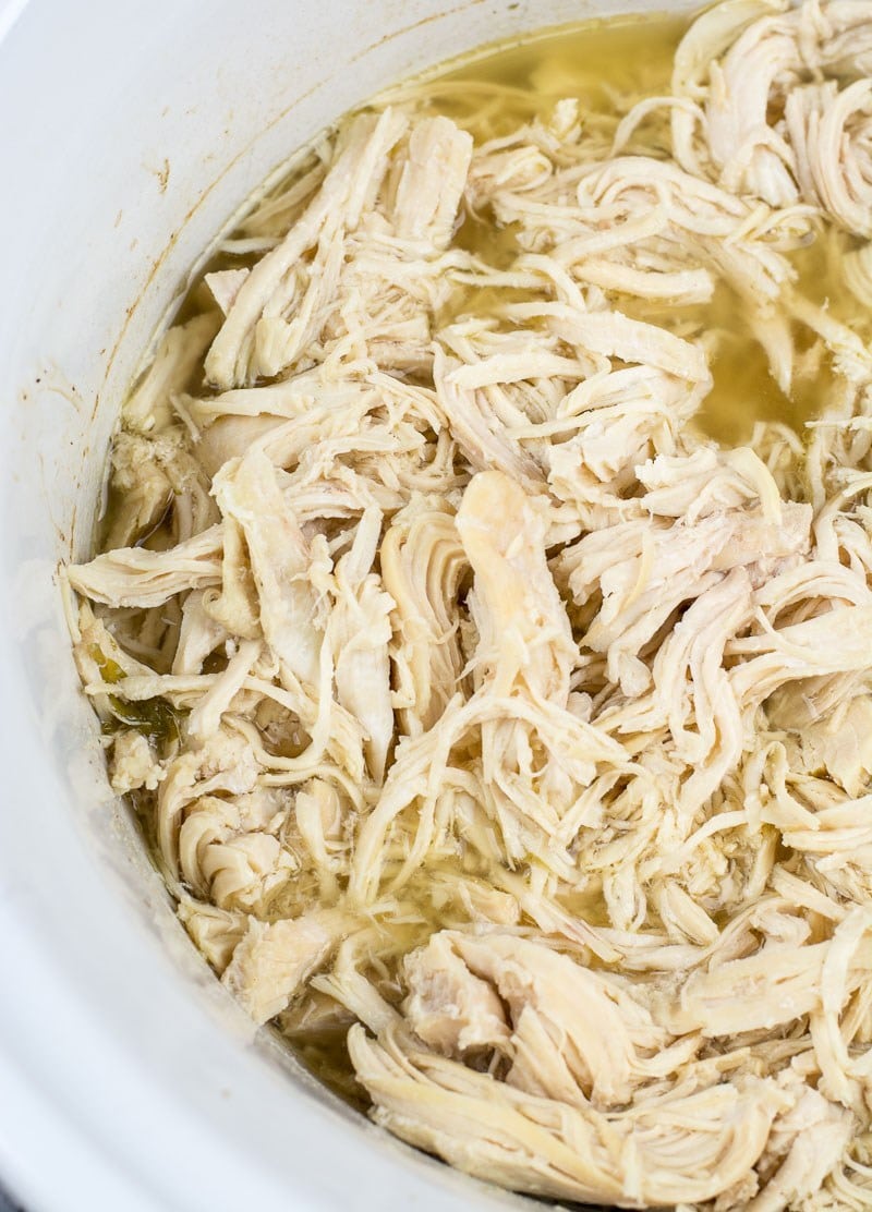 This easy all purpose Slow Cooker Shredded Chicken only requires a few ingredients and makes the best shredded chicken! Perfect for meal prep, casseroles, wraps and more!