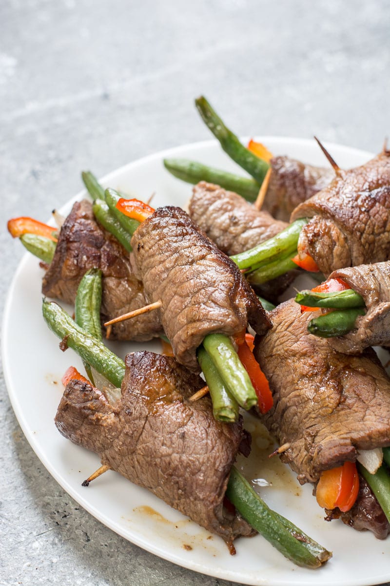 These steak rolls cook best if you do not over fill them. Generally, I fill these with roughly 2 of each. Two green beans, 2 very thin slices of bell pepper and onion. I find small slices of steak about 2 inches x 3 inches is just about perfect for that ratio. You can make this however you wish just remember if you make them thicker your cooking time will increase and if you fill these with more vegetables your carb count will increase if you are on keto.