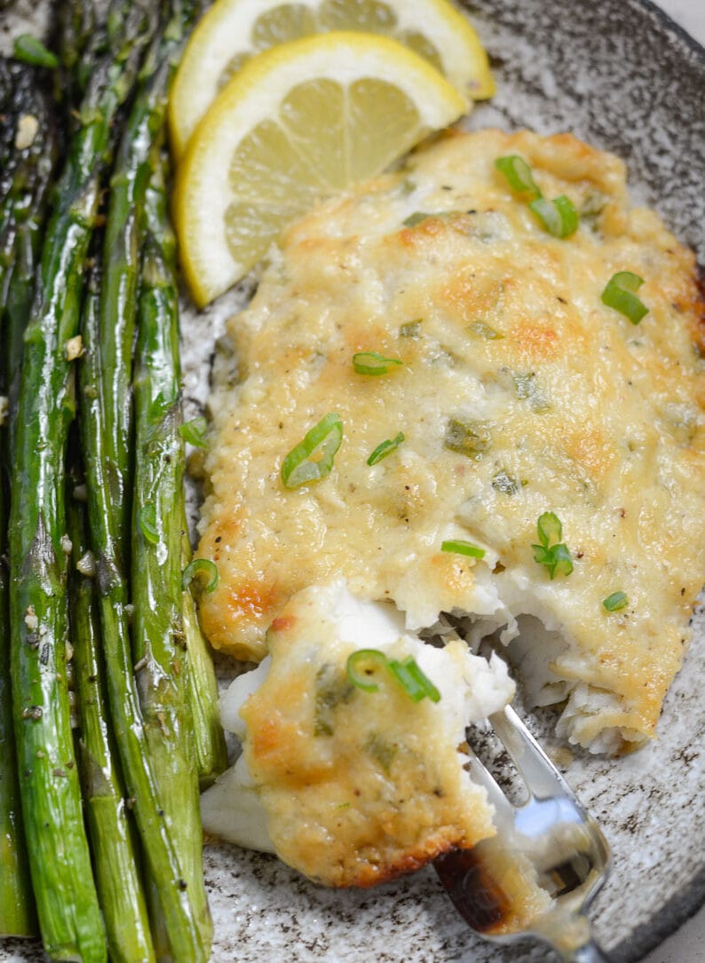 This Keto Parmesan Tilapia and Asparagus is the perfect low carb recipe for one! At only 3.8 net carbs per serving this 20 minute meal is the perfect keto recipe for busy nights!