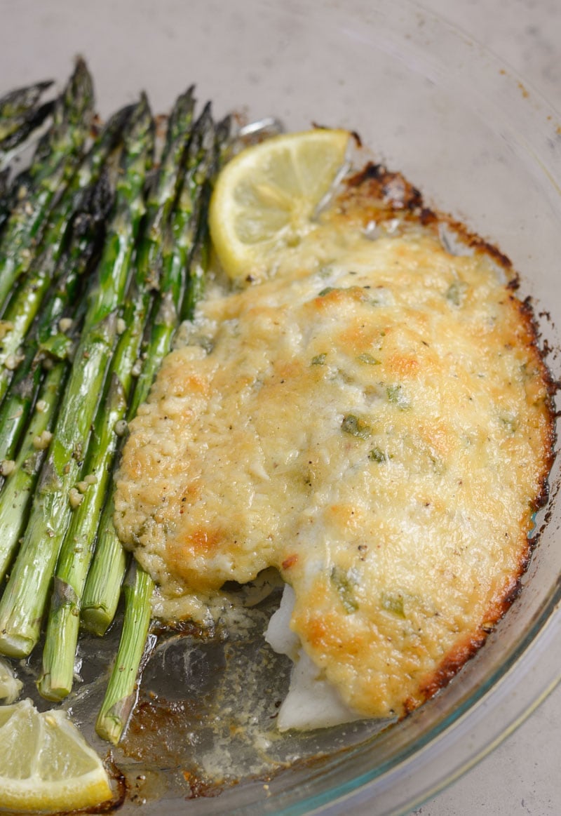 This Keto Parmesan Tilapia and Asparagus is the perfect low carb recipe for one! At only 3.8 net carbs per serving this 20 minute meal is the perfect keto recipe for busy nights!