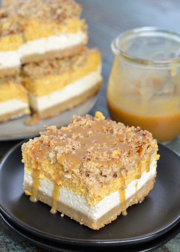 These Keto Pumpkin Cheesecake Bars are a low carb delight! At just 3.3 net carbs per serving this is the perfect Fall dessert recipe!