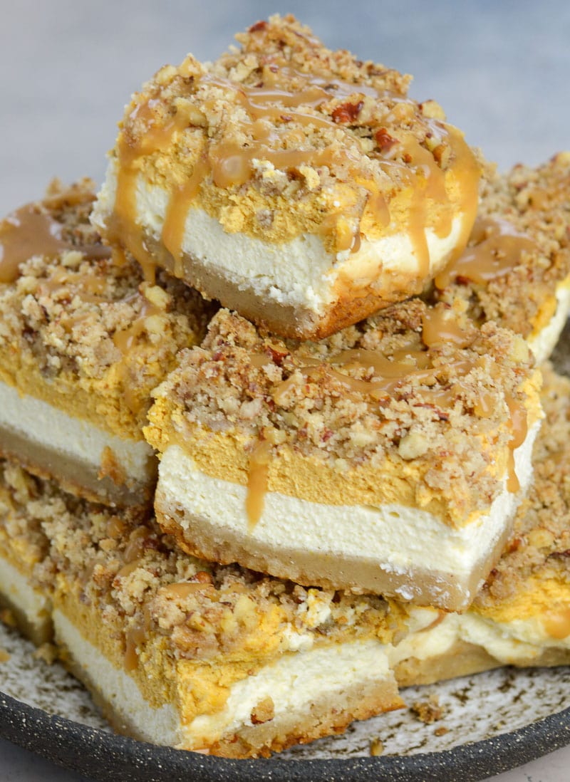 These Keto Pumpkin Cheesecake Bars are a low carb delight! At just 3.3 net carbs per serving this is the perfect Fall dessert recipe!