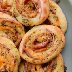 These Keto Ham and Cheese Rolls are smothered in a garlic poppy seed sauce you will love! These savory, low carb rolls come to just under 2 net carbs each!