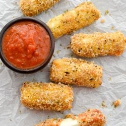 These Easy Keto Mozzarella Sticks are covered in an ultra crispy crust and fried to perfection! 