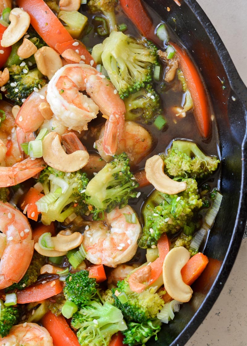 Keto Shrimp and Broccoli Stir-Fry is a quick and easy one pan recipe that has about 6 net carbs per serving! Loaded with vegetables and a sesame garlic sauce, this will become a family favorite! 