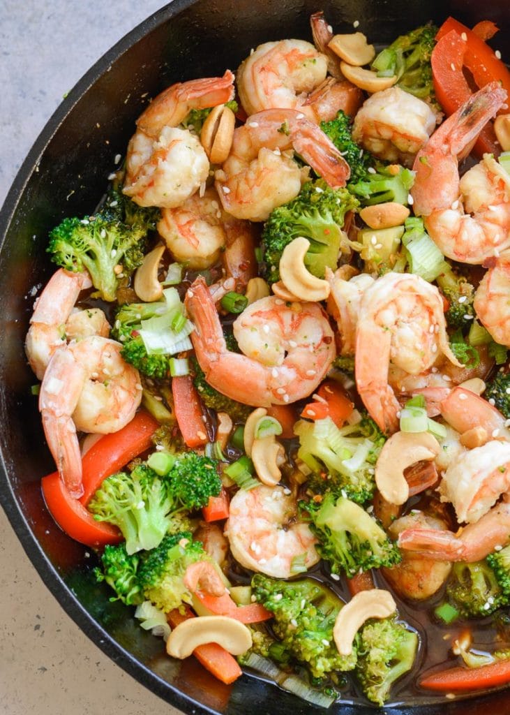 Keto Shrimp and Broccoli Stir-Fry is a quick and easy one pan recipe that has about 6 net carbs per serving! Loaded with vegetables and a sesame garlic sauce, this will become a family favorite! 