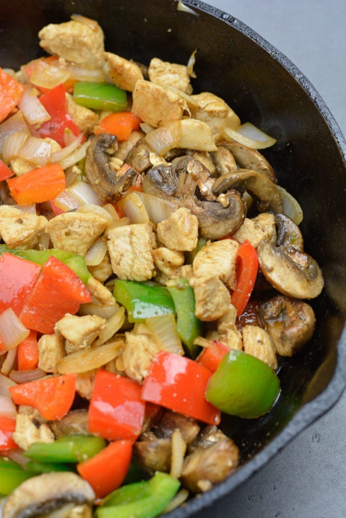 Try this Chicken Philly Cheesesteak Skillet packed with pan seared chicken, mushrooms, bell peppers and onions. This easy one pan recipe has less than 5 net carbs per serving! 