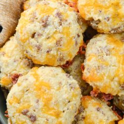 These Keto Sausage Cheddar Biscuits are loaded with flavor and have less than two net carbs each. Pair with scrambled eggs and enjoy the perfect keto breakfast! 