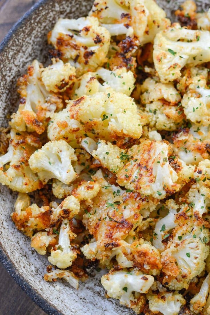 Parmesan Roasted Cauliflower is perfectly seasoned and roasted until crisp and full of flavor! Each serving has about 3 net carbs, making it an excellent keto side dish! 