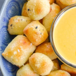 These soft Keto Pretzel Bites with Cheese Sauce are the perfect low carb appetizer! Enjoy 8 bites with cheese dip for less than 5 net carbs! 
