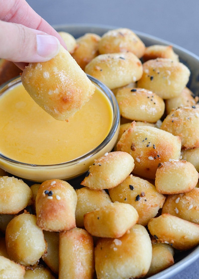 These soft Keto Pretzel Bites with Cheese Sauce are the perfect low carb appetizer! Enjoy 8 bites with cheese dip for less than 5 net carbs! 