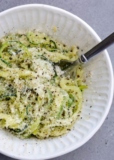 Caico e Pepe Zoodles are a quick and easy, low carb spin on an Italian classic! Buttery zucchini noodles are tossed with freshly grated cheese and loads of pepper for the perfect keto-friendly meal!