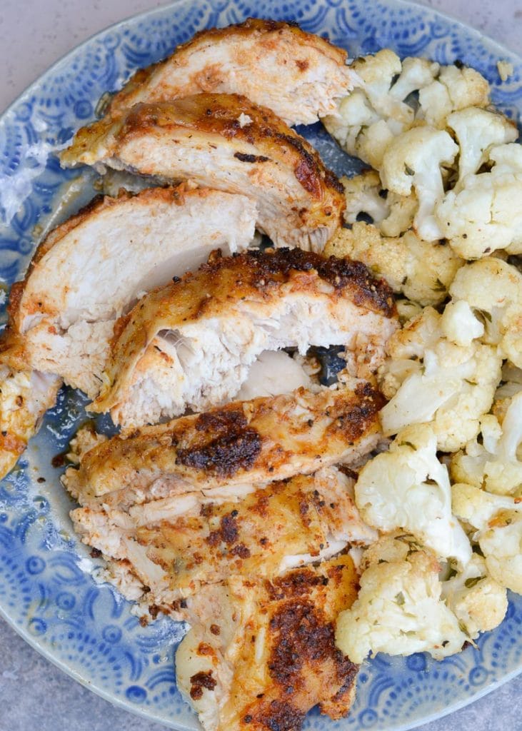 This Perfect Roast Chicken cuts like a dream! This super juicy chicken is perfect with roasted cauliflower!
