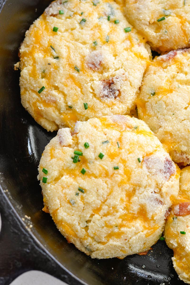 These Keto Bacon Cheddar Chive Biscuits are exploding with flavor! Packed with sharp cheddar cheese, crispy bacon and fresh chives, these biscuits are the perfect low-carb side with just 4 net carbs each!