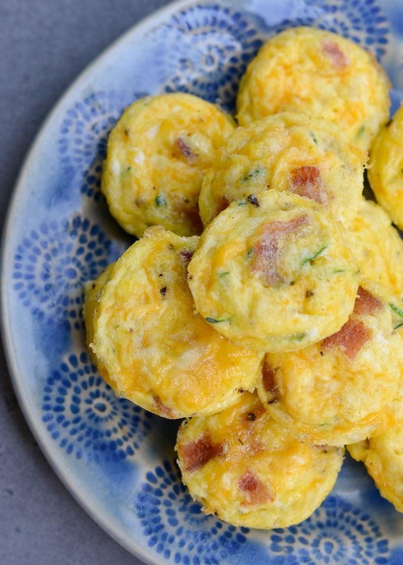 These savory Bacon Egg and Zucchini Bites are loaded with fresh veggies, salty bacon and tons of cheese! Each mini muffin has just 0.2 net carbs each making them an amazing keto breakfast option!