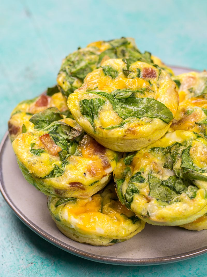 These Keto Spinach and Bacon Egg Muffins are loaded with fresh spinach, sharp cheddar and salty bacon! These low carb egg muffins are about one net carb each and perfect for keto meal prep!