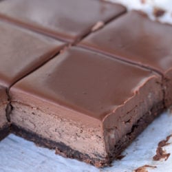 These Triple Chocolate Cheesecake Bars feature a chocolate shortbread crust, dark chocolate cheesecake and a rich chocolate ganache layer. Each decadent cheesecake bar has less than 3 net carbs and is sure to satisfy your sweet tooth!