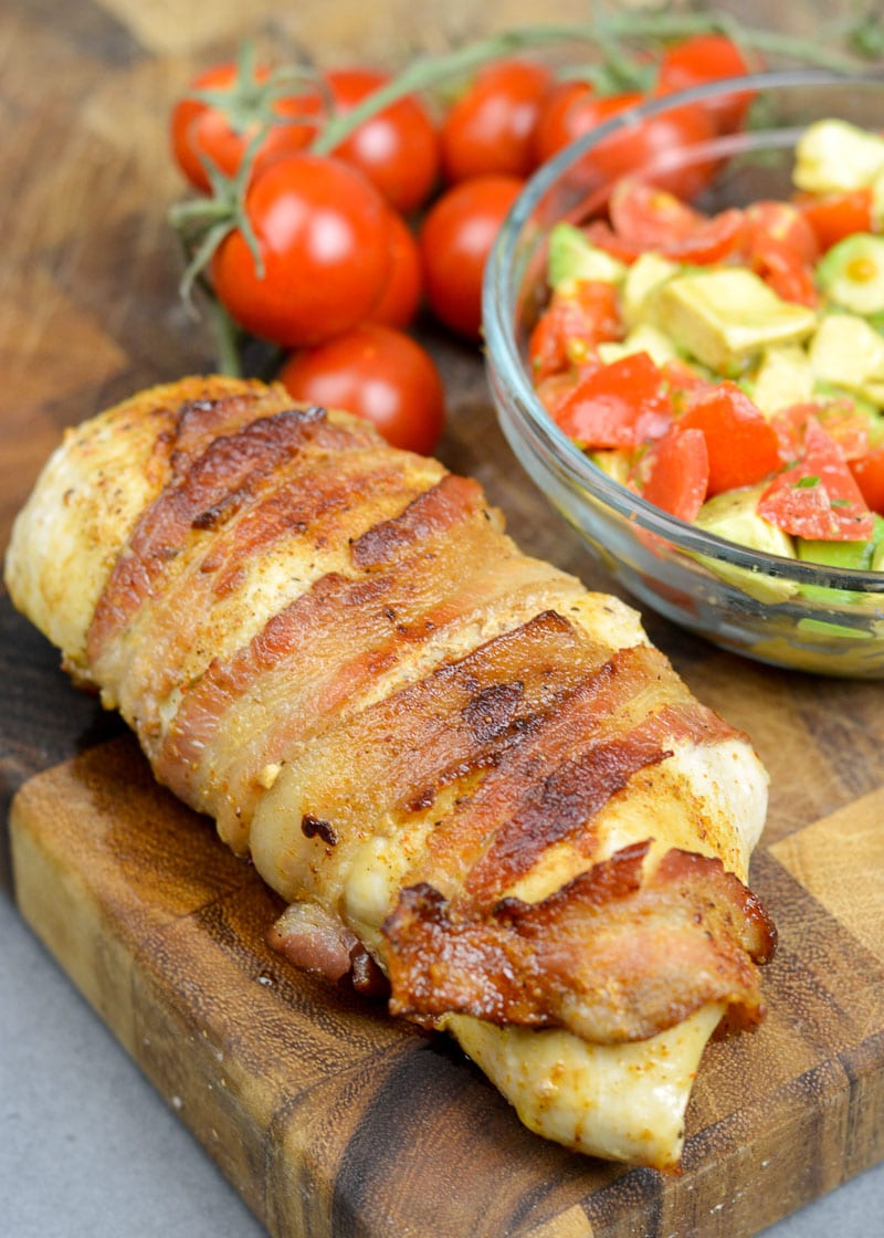 This easy Bacon Wrapped Chicken Breast is a one pan, 30 minute meal! This keto friendly chicken recipe is great with roasted vegetables and reheats well for weekly meal prep!