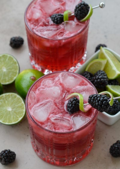 Try a Blackberry Bourbon Smash for a skinny keto cocktail! This beautiful low carb drink is perfect for a summer day and only 2.5 net carbs each!