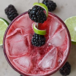 Try a Blackberry Bourbon Smash for a skinny keto cocktail! This beautiful low carb drink is perfect for a summer day and only 2.5 net carbs each!