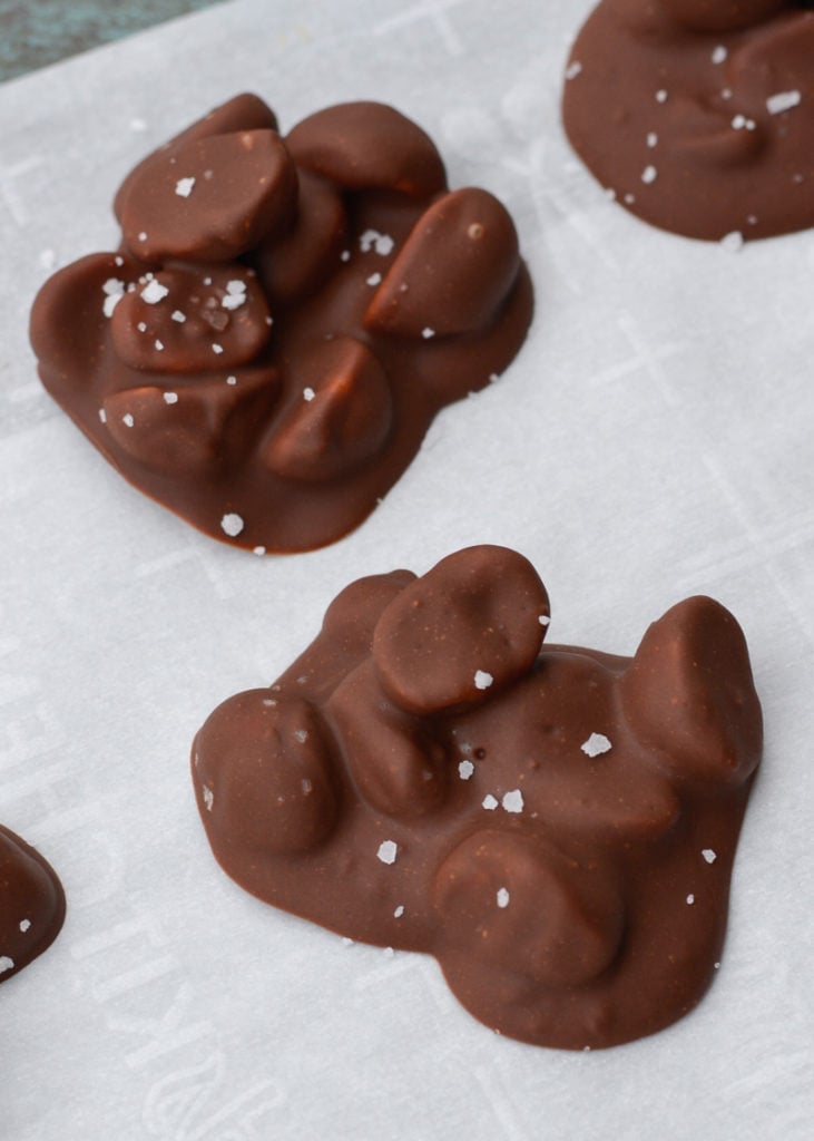 Three ingredient Chocolate Covered Macadamia Nuts are the perfect keto snack! These low carb, sugar free chocolate treats contain just 2 net carbs each! 