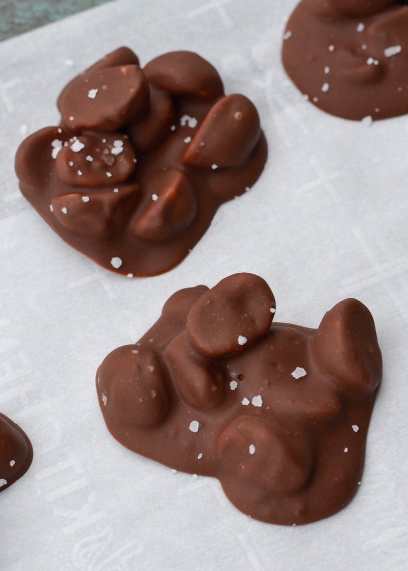 Three ingredient Chocolate Covered Macadamia Nuts are the perfect keto snack! These low carb, sugar free chocolate treats contain just 2 net carbs each!