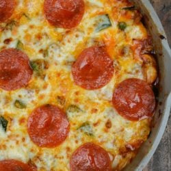 Keto Pizza is the perfect easy dinner recipe! This low carb dinner is packed with Italian sausage, zucchini, peppers, marinara and cheese!