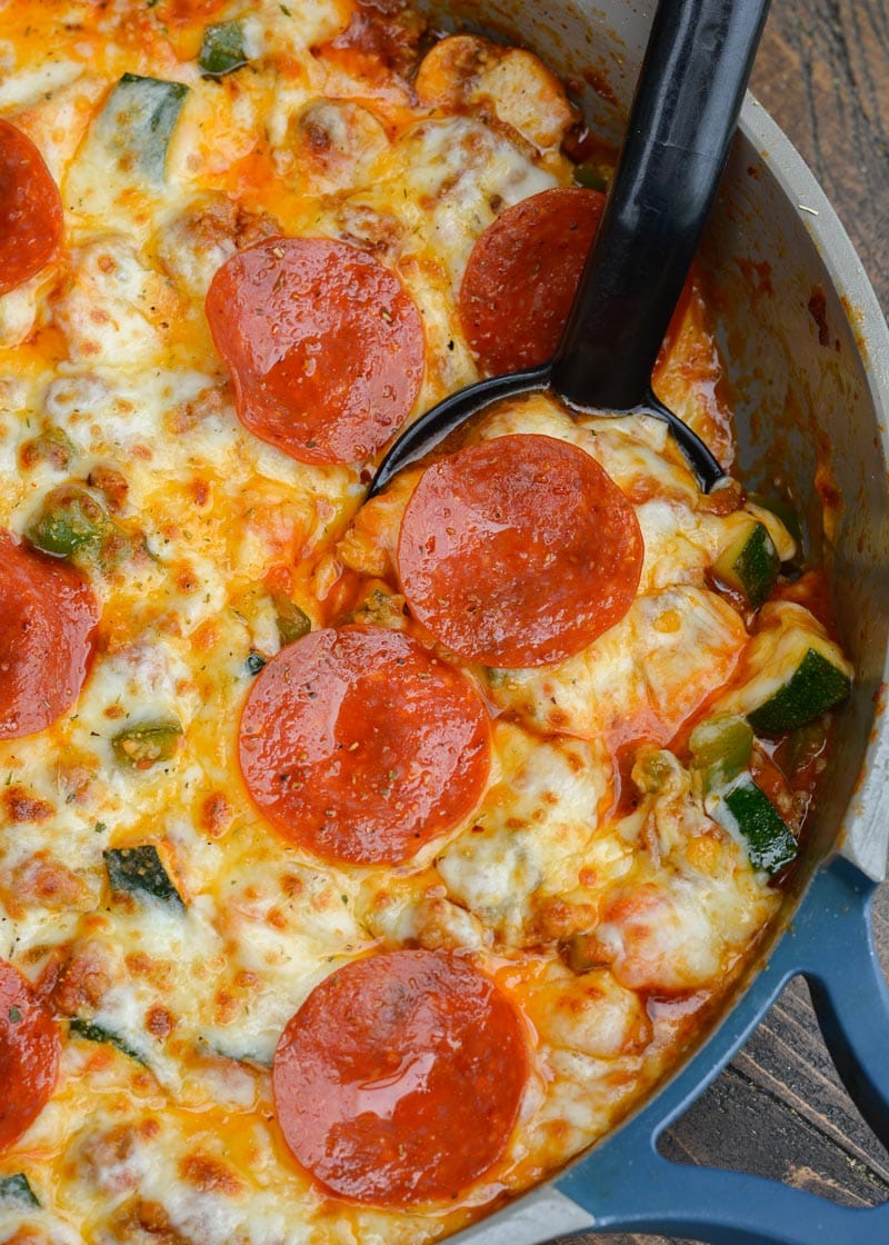 Keto Pizza is the perfect easy dinner recipe! This low carb dinner is packed with Italian sausage, zucchini, peppers, marinara and cheese! 