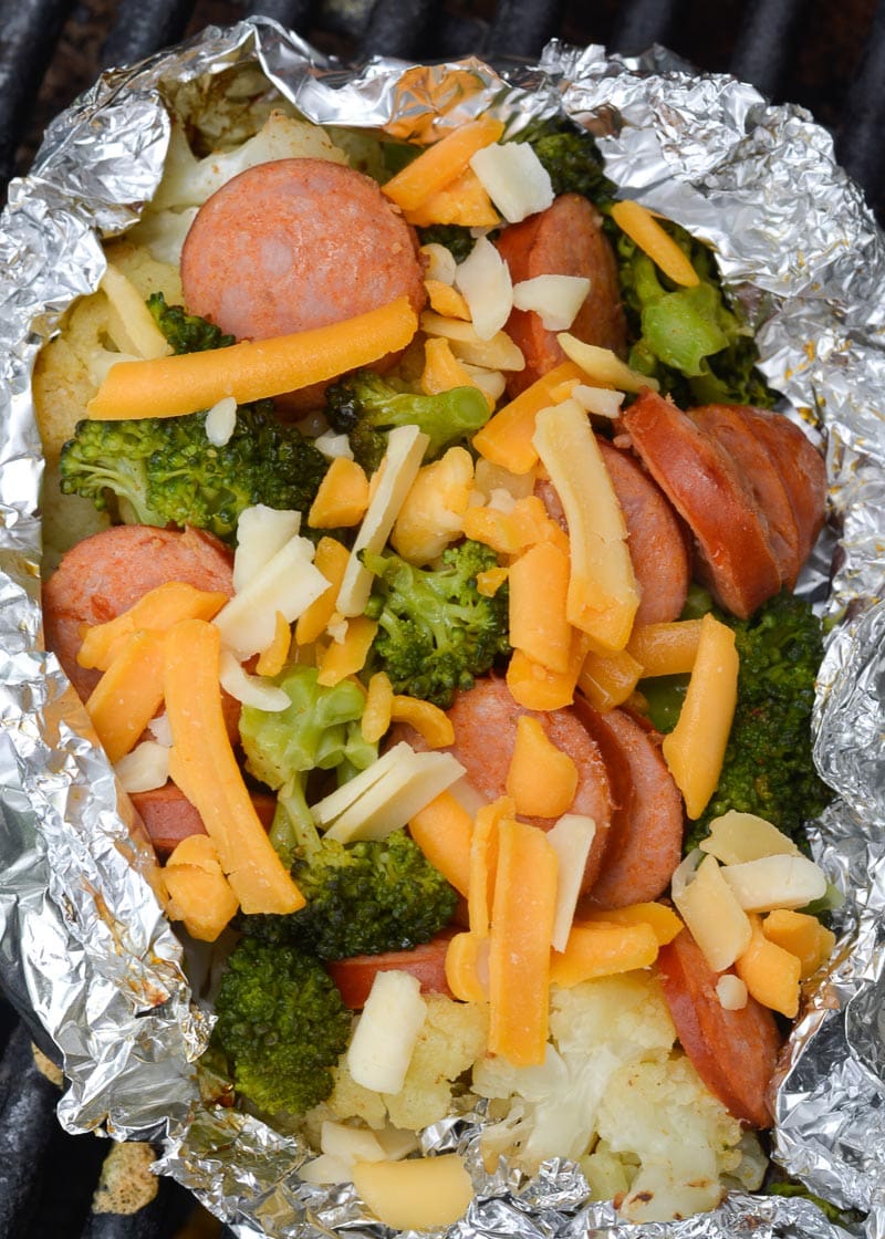This easy weeknight meal is packed with flavor. The spicy Cajun seasoning of the andouille sausage is complimented perfectly by the Old Bay. By putting everything into a foil packet, your veggies and meat will be cooked until tender, then sprinkled with cheddar cheese. This low carb recipe comes out to only 6.2 net carbs, making it perfect for your keto diet!