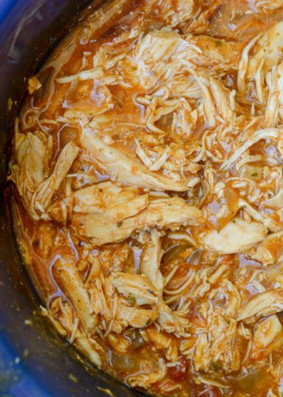 This Crock Pot Salsa Chicken is the best set it and forget it meal! Tender shredded chicken is combined with taco seasoning and enchilada sauce for a flavor packed keto dinner recipe!