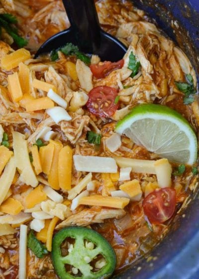 This Crock Pot Salsa Chicken is the best set it and forget it meal! Tender shredded chicken is combined with taco seasoning, enchilada sauce and garlic for a flavor packed easy dinner recipe that is perfect for keto meal prep!