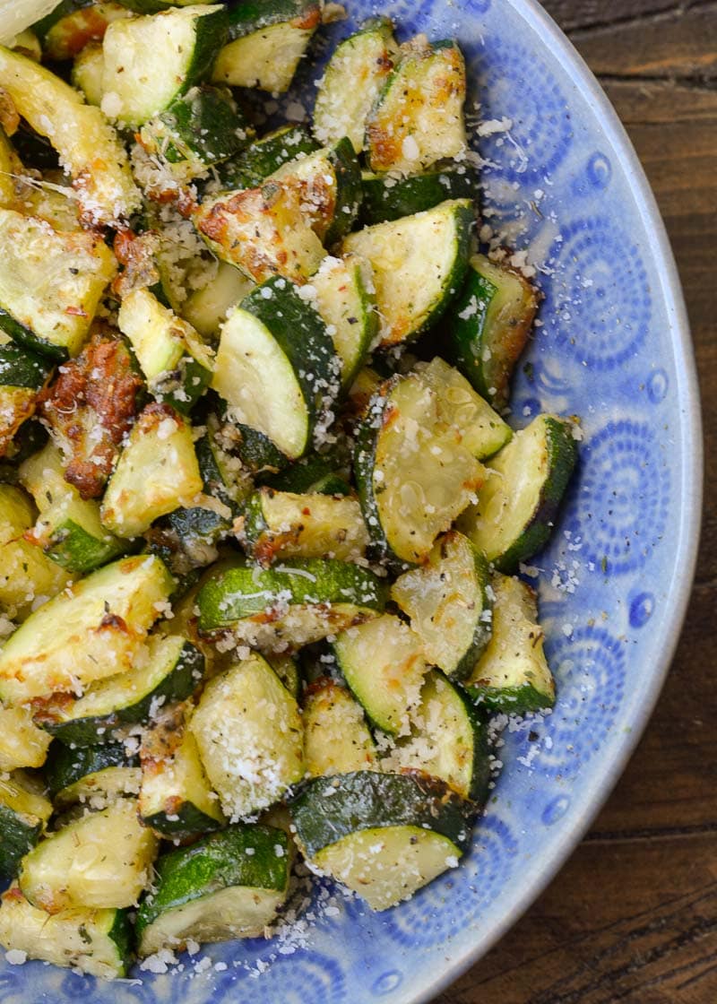 Learn how to make delicious Air Fryer Zucchini with Parmesan! This keto side dish has only four ingredients, is ready in under 10 minutes and has less than 4 net carbs!