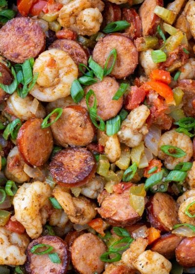 This Creole Shrimp and Sausage Skillet is the perfect 20 minute dinner recipe! This dish is packed with smoked sausage, tender shrimp, and vegetables in a buttery cajun sauce!