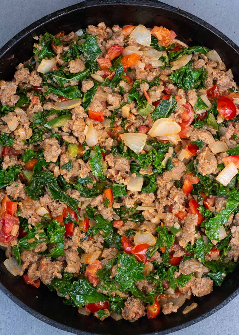 This simple Italian Sausage and Kale skillet is a hearty one pan meal loaded with meat and vegetables! Enjoy a generous helping for just 6 net carbs!