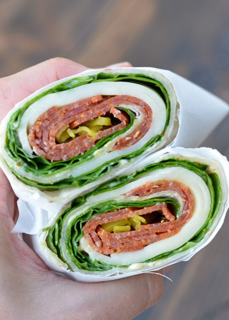 These Pepperoni Cheese Wraps are the perfect keto lunch! Deli pepperoni is paired with smoky provolone, fresh spinach and flavorful pesto aoili, all for about 5 net carbs!