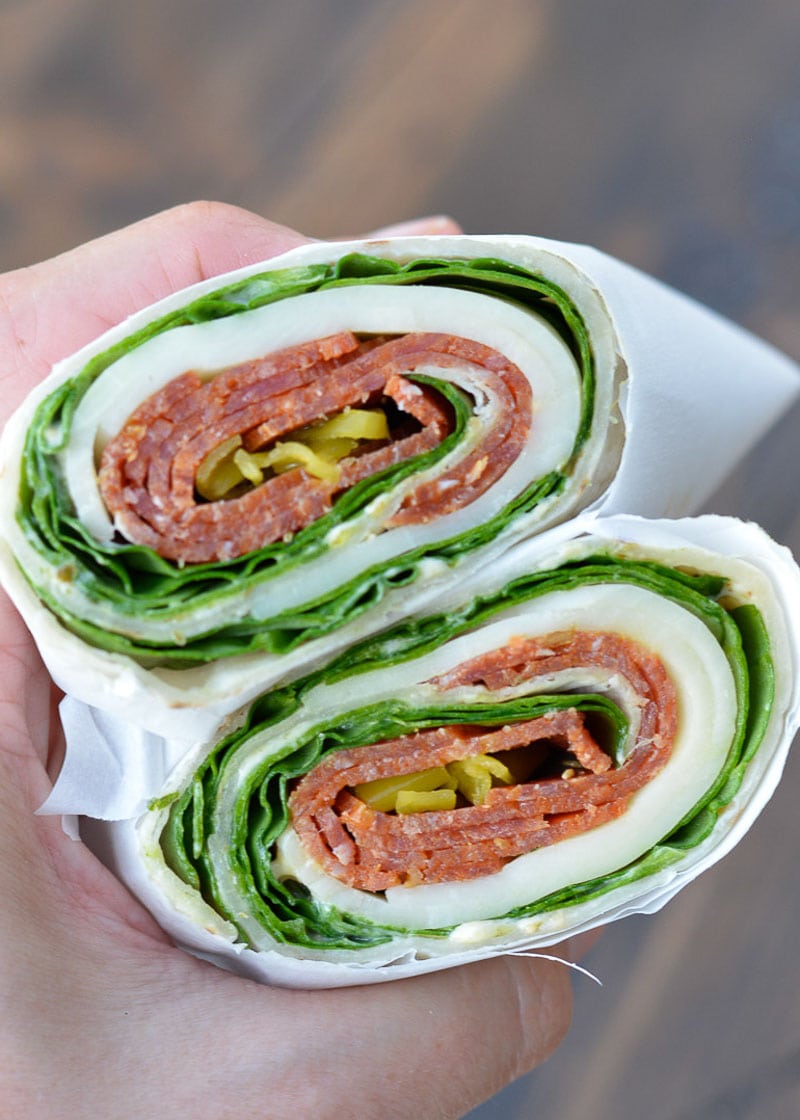 These Pepperoni Cheese Wraps are the perfect keto lunch! Deli pepperoni is paired with smoky provolone, fresh spinach and flavorful pesto aoili, all for about 5 net carbs!