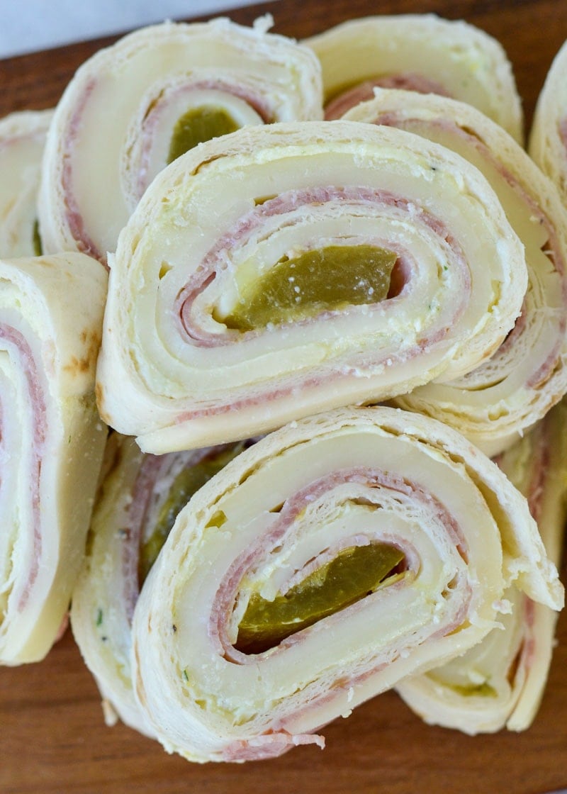 These Keto Italian Pinwheels are the perfect appetizer or party snack! Enjoy five cheesy, salty pinwheels for about 4 net carbs each!